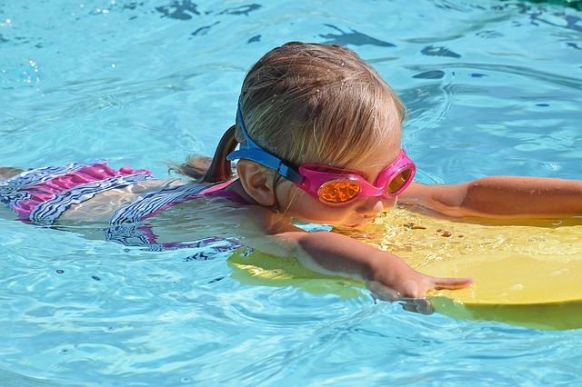 Young swimmer in a clean pool